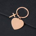 Rose gold cross and heart pendant keychain on a black background, customizable metal keyring - Heart Style / Rose Gold