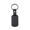 Close-up of black matte metal military tag and textured leather keychain connector - Black Rectangular Tag / Black Leather Style 50x28mm Army Tag Keychain