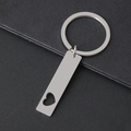 Detailed macro view of silver stainless steel keychain with heart cut-out and mirror polish - 41*10mm Long Bar (Heart Hollow) + Key Ring / Silver
