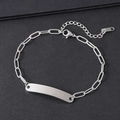 Detail view of silver stainless steel paperclip chain with a blank rectangular metal bar - Silver