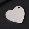 Close-up of polished heart-shaped stainless steel tag with single hole on black background - 30*28.5mm Slanted Heart Silver
