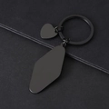 Macro shot of matte black stainless steel keychain with diamond and heart pendants - 50*23mm Rhombus Heart Keyring Black