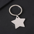 Polished silver star-shaped keychain on grey background with premium metallic texture - 32*29.9mm Star with Key Ring in Silver