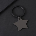 Detailed top view of matte black star-shaped metal keychain on textured black background - 32*29.9mm Star with Key Ring in Black