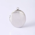 Close-up of an oval stainless steel photo locket pendant with a polished silver finish - Silver Photo Locket Pendant