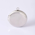 Detailed macro view of a polished stainless steel round photo locket with a side hinge - Round Plain Locket Pendant Silver