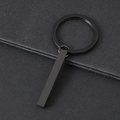 Close-up of minimalist black stainless steel rectangular bar pendant on a matte key ring - Black Cuboid Bar With Key Ring / Black Style