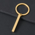 Polished gold rectangular bar keychain made of stainless steel on dark textured background - Gold Cuboid Bar With Key Ring / Gold Style