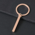 Polished rose gold minimalist stainless steel cube keychain on a textured dark background - Rose Gold Cuboid Bar With Key Ring / Rose Gold Style