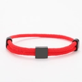 Detailed close-up of double-layered red braided cord bracelet with matte black square charm - Square Charm (Double Buckle) / Red