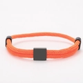 Detailed close-up of orange braided Milanese cord bracelet with black square slider and metal ends - Square Charm (Double Buckle) / Orange