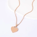 Rose gold heart pendant necklace on white stone with polished finish and cable chain - Heart Necklace (Rose Gold)
