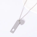 Close-up of polished stainless steel bar with heart cutout and solid heart pendant - 40*10mm Cutout Heart Bar + Heart Pendant / Silver