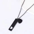 Detail shot of black stainless steel chain necklace with hollow bar and solid heart charms - 40*10mm Cutout Heart Bar + Heart Pendant / Black