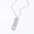 Macro shot of stainless steel rectangular pendant with heart cutout on silver cable chain - 40*10mm Hollow Heart Silver