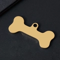 Polished gold bone-shaped metal pet ID tag on elegant black leather background - Bone Style / 34.8x16.4mm / Gold