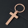Polished rose gold stainless steel cross keychain on a textured dark background - Rose Gold