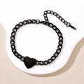 Detailed macro view of black stainless steel heart charm on a Cuban chain bracelet - Heart Tag (Black)