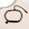 Detailed close-up of a black stainless steel Cuban chain bracelet with customizable bar - Black