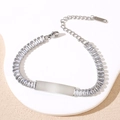 Detailed macro view of silver stainless steel zircon bracelet with blank engraving bar - Silver White Stone