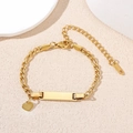 Gold stainless steel Figaro bracelet with rectangle ID plate and heart charm pendant - Gold