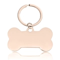 Polished rose gold bone-shaped stainless steel pet ID tag and keychain on white background - Rose Gold Bone 50x28mm With Keyring