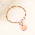 Detail view of a rose gold chain bracelet with OT toggle clasp and smooth round pendant - Rose Gold 20mm Round Toggle Bracelet
