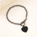 Detail view of heart charm bracelet with T-bar toggle closure in gunmetal black finish - Black 20mm Heart Toggle Bracelet