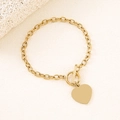 Detail of a golden stainless steel chain bracelet with heart charm and OT toggle clasp - Gold 20mm Heart Toggle Bracelet