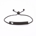 Detail showing matte black stainless steel bar bracelet with heart cutout and box chain - Black Heart Cutout Bar / Black