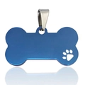 Detail view of bone-shaped blue stainless steel pet ID tag with a hollow paw print design - Small / Blue
