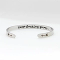 Polished silver C-shaped stainless steel cuff bracelet with motivational engraving - Keep Fucking Going Style 1 Silver