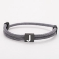 Adjustable grey woven Milan rope bracelet with a black stainless steel square letter J charm - Letter J (SLF010) / Gray