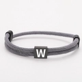 Adjustable grey woven Milan rope bracelet with a black square block featuring letter W - Letter W (SLF023) / Gray