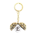 Détail du porte-clés tournesol doré ouvrant avec la lettre E gravée à l'intérieur - Style Lettre E (T00029) / Or