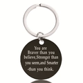 Macro detail of black stainless steel pendant keychain with engraved motivational quote - Matte Motivational Style (Y00005)
