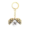 Détail du porte-clés médaillon tournesol avec lettre M cursive personnalisée gravée - Style Lettre M (T00037) / Or