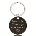 Macro detail of black stainless steel keychain with Drive Safe engraved text and hearts - Safe Driving Style (Y00018)