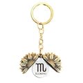 Detail of opening golden sunflower keychain with Scorpio zodiac sign engraving inside - Gold Scorpio (T00020)