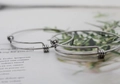 Set of two silver adjustable stainless steel wire bracelets on a lifestyle background - Single Bangle (Without Pendant)