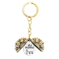 Close-up of engraved sunflower locket keychain with mi mama text and mother daughter illustration - Gold Sunflower-Mi Mama Family of 3 (T00071)