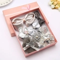 Set de 9 piezas de accesorios para el pelo de niña en tonos plateados y rosas - Gris