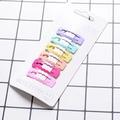 Set of six pastel matte wavy hair clips in purple, green and pink on display card - Square Wavy Edge