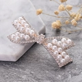 Elegant silver bow hair clip featuring white faux pearls and sparkling rhinestones - Cross Pearl