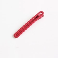 Minimalist red wave-shaped metal hair clip with a matte finish for hair styling - Red