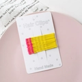 Set of 10 yellow bobby pins with pink match head tips on a white display card - Yellow