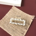 Detail shot of golden metal hair claw with inlaid pearls and sparkling rhinestones - Small Pearl Rhinestone Square