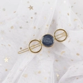 Detail of gold metal star hair clip with blue marble resin inlay on white lace mesh - Round Blue