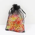 Colorful elastic hair ties for kids stored in a black mesh drawstring pouch with a macro view - Organza Bag - Colored Grid