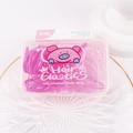 Close-up of pink elastic hair bands in a cute storage box with cartoon pig card - Pink Series